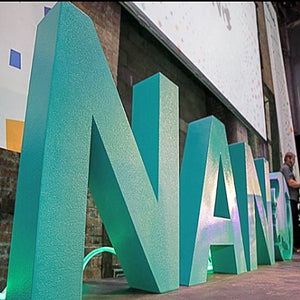 Bold teal foam letters spelling NANO are showcased in a striking 3D display. Crafted for high impact branding, these oversized letters are lightweight, customizable, and perfect for events, conferences, or photo opportunities. Their durable design ensures they stand out as a centerpiece for corporate and promotional use.